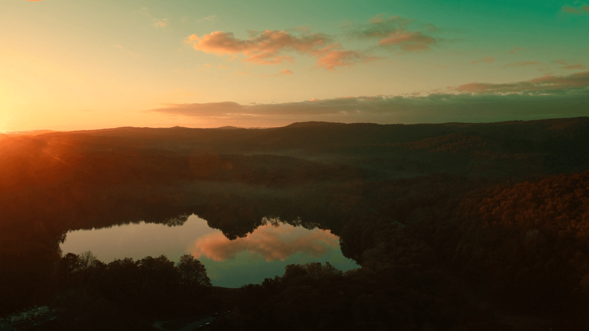 Golden-hour view over a lake and forested ridgeline on the Cumberland Plateau, Fairfield Glade, Tennessee